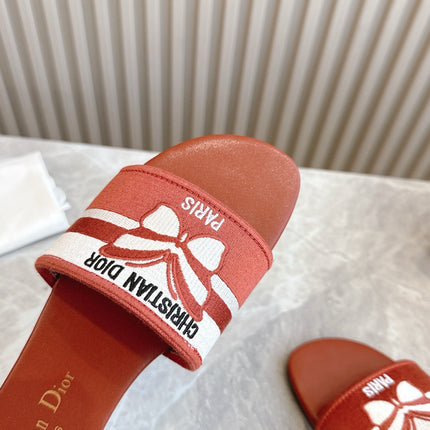 DIOR FLAT SLIDES 25S IN DARK ORANGE CALFSKIN AND FABRIC BRAND NAME EMBROIDERY