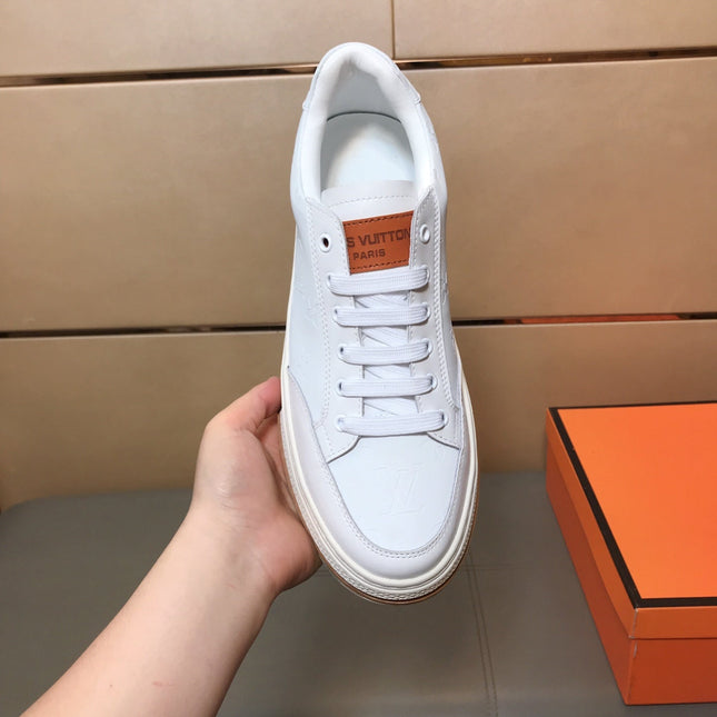 LV TRAINER IN EMBOSSED WHITE SUEDE