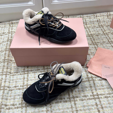 MIUMIU 26S SNEAKERS IN BLACK SUEDE AND SHEARLING