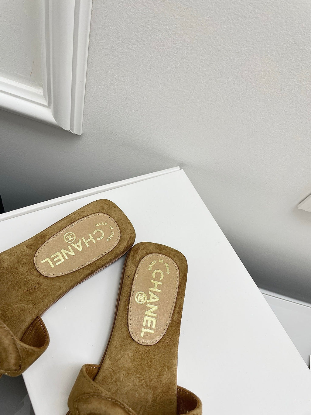 CHANEL CC LOGO MULES IN DARK BEIGE SUEDE