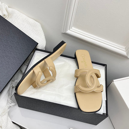CHANEL CC LOGO MULES IN BEIGE CALFSKIN