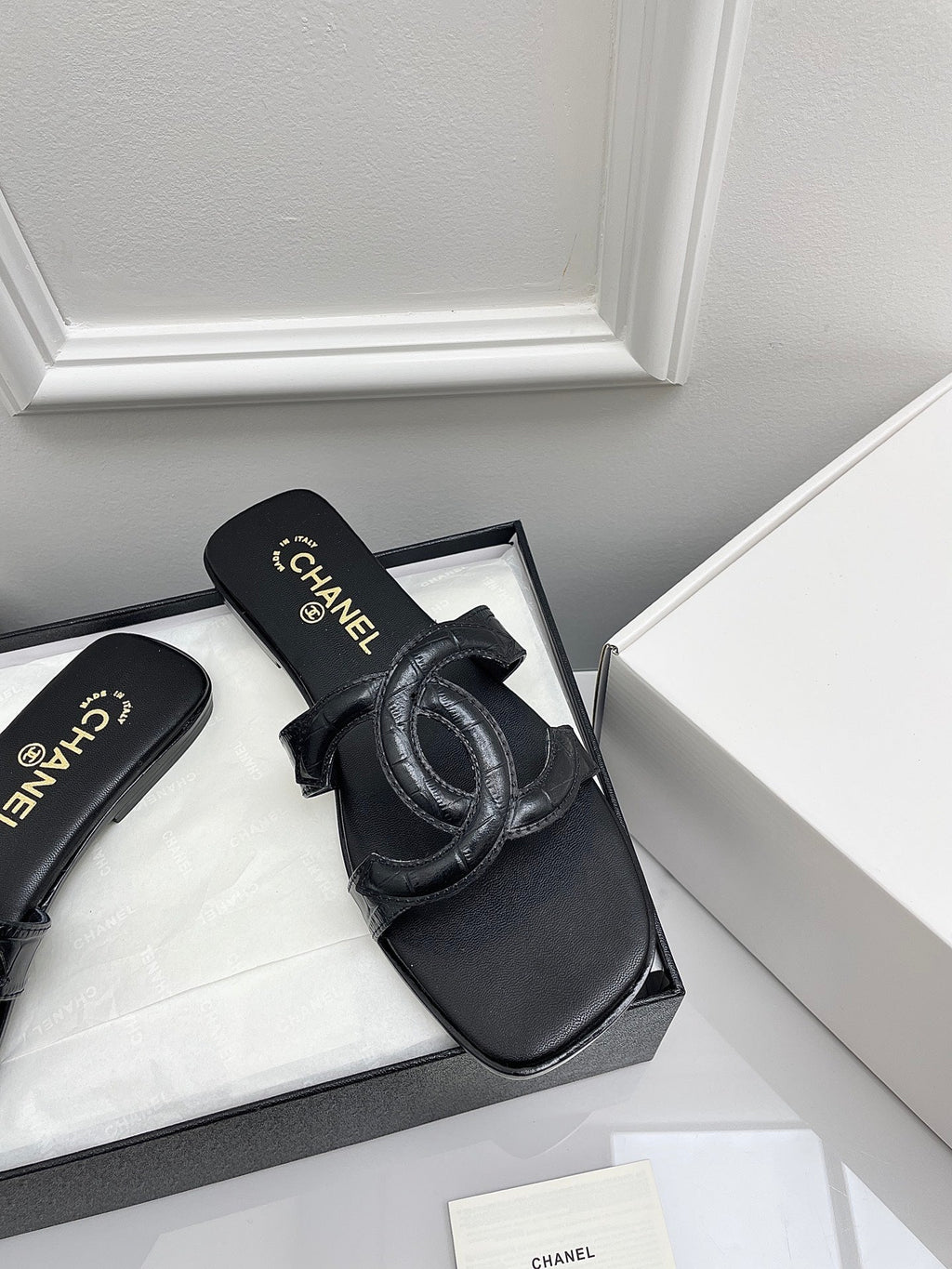 CHANEL CC LOGO MULES IN BLACK CALFSKIN