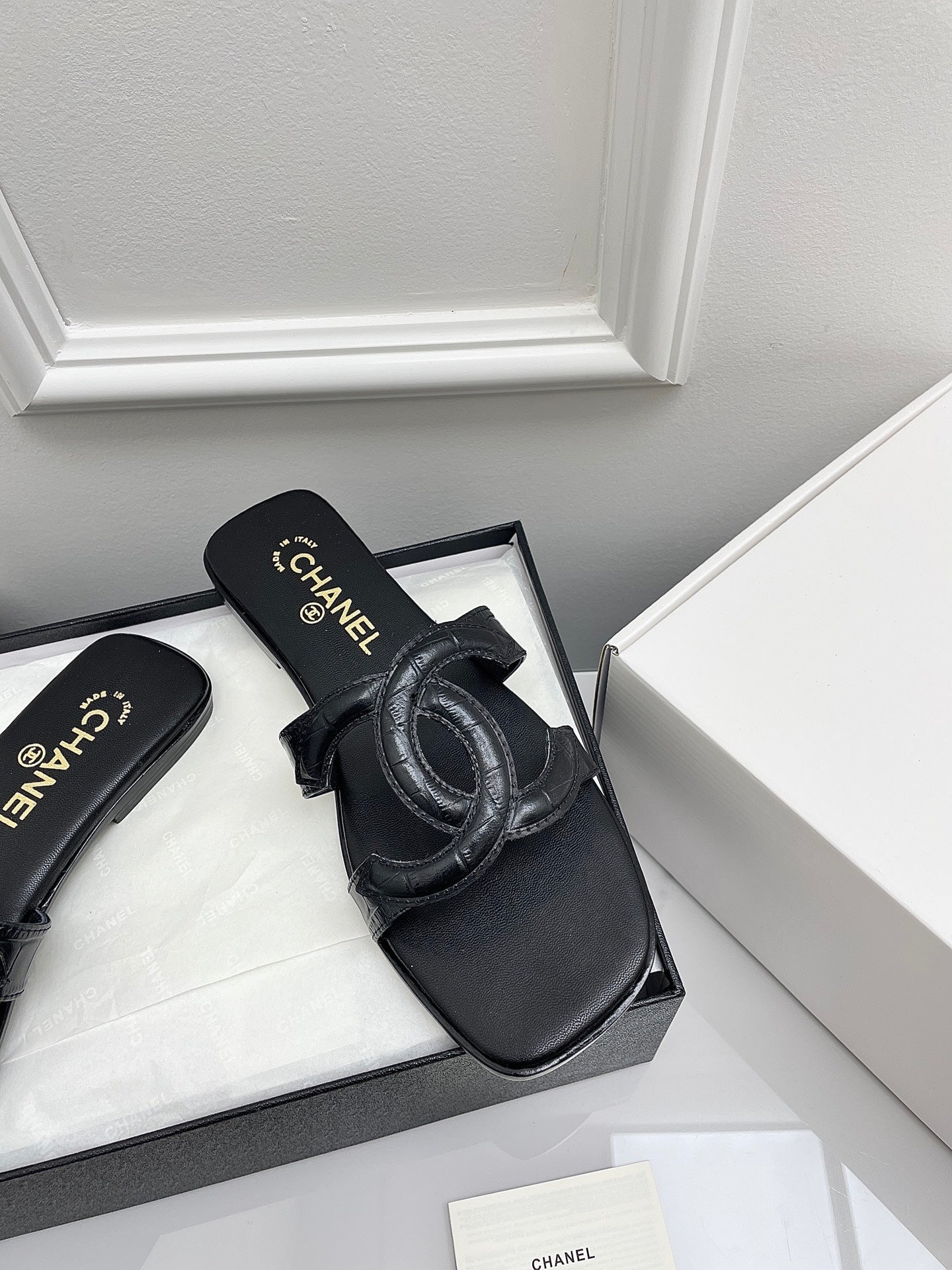 CHANEL CC LOGO MULES IN BLACK CALFSKIN