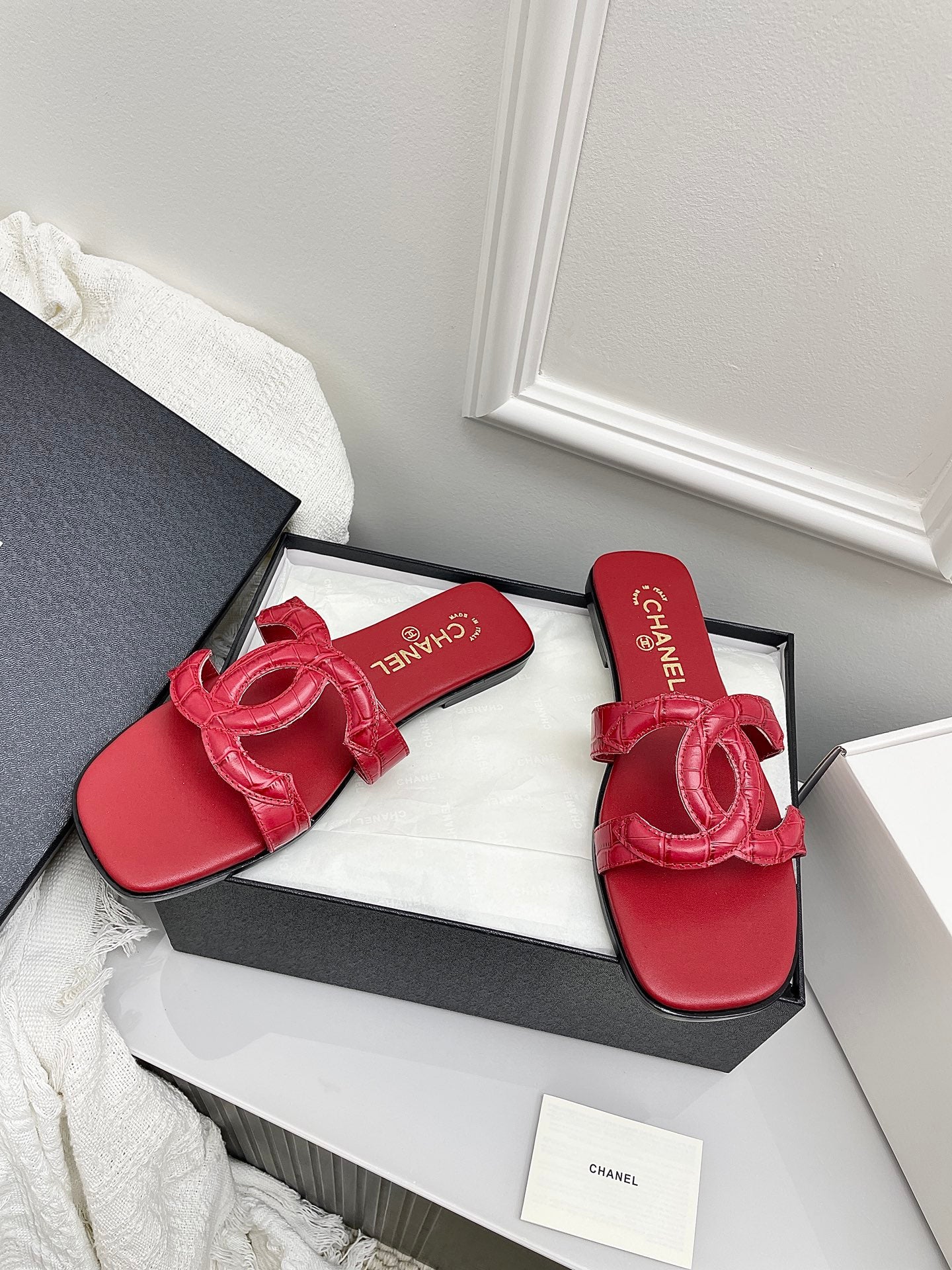 CHANEL CC LOGO MULES IN RED CALFSKIN