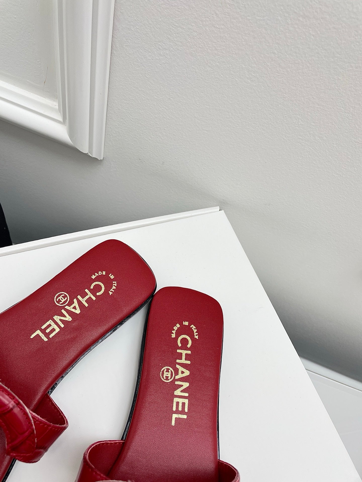 CHANEL CC LOGO MULES IN RED CALFSKIN