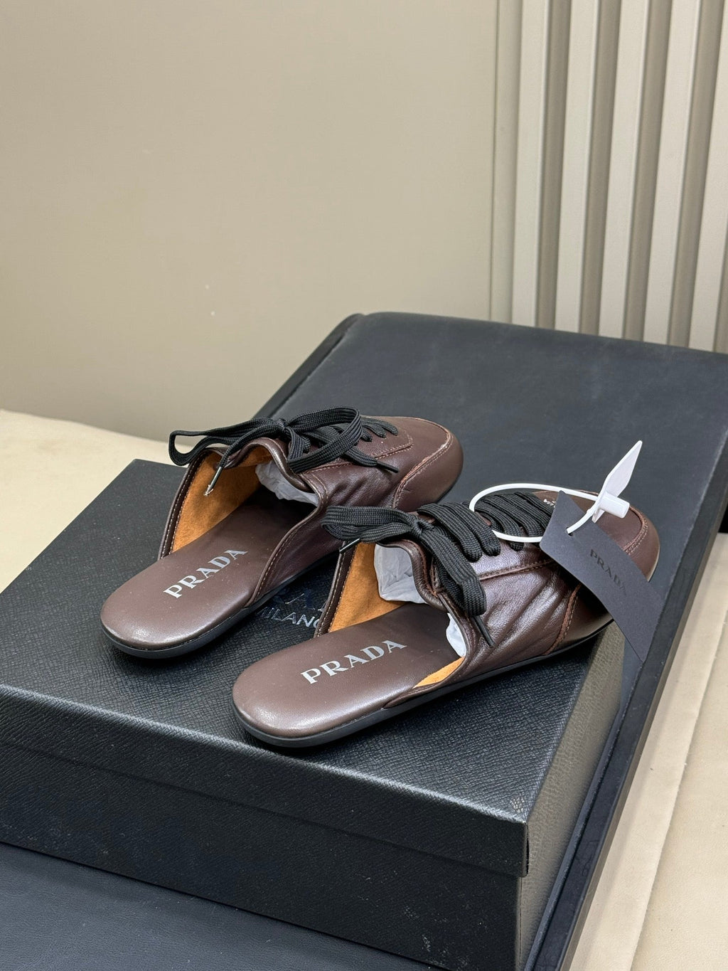 PRADA 25S COLLAPSE MULES IN DARK BROWN CALFSKIN