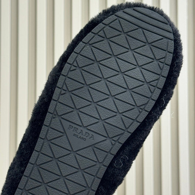 PRADA 25S CLOGS IN BLACK SHEARLING