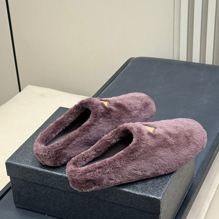 PRADA 25S CLOGS IN WINE RED SHEARLING