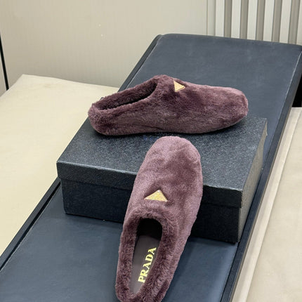 PRADA 25S CLOGS IN WINE RED SHEARLING