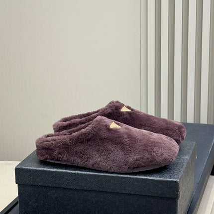 PRADA 25S CLOGS IN WINE RED SHEARLING