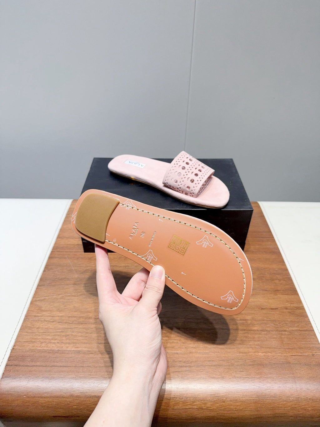 ALAIA FLAT SANDALS WITH PERFORATED STRAPS 25S IN LIGHT PINK SUEDE