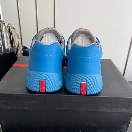 PRADA 26S AMERICA CUP SNEAKERS IN AZURE BLUE SOFT RUBBER AND BIKE FABRIC