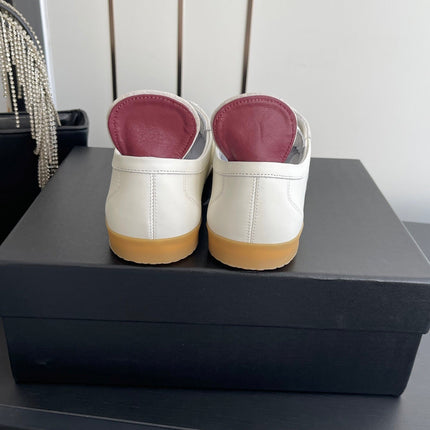CHANEL LOW-TOP SNEAKERS IN BLACK AND WHITE CALFSKIN MIX SUEDE