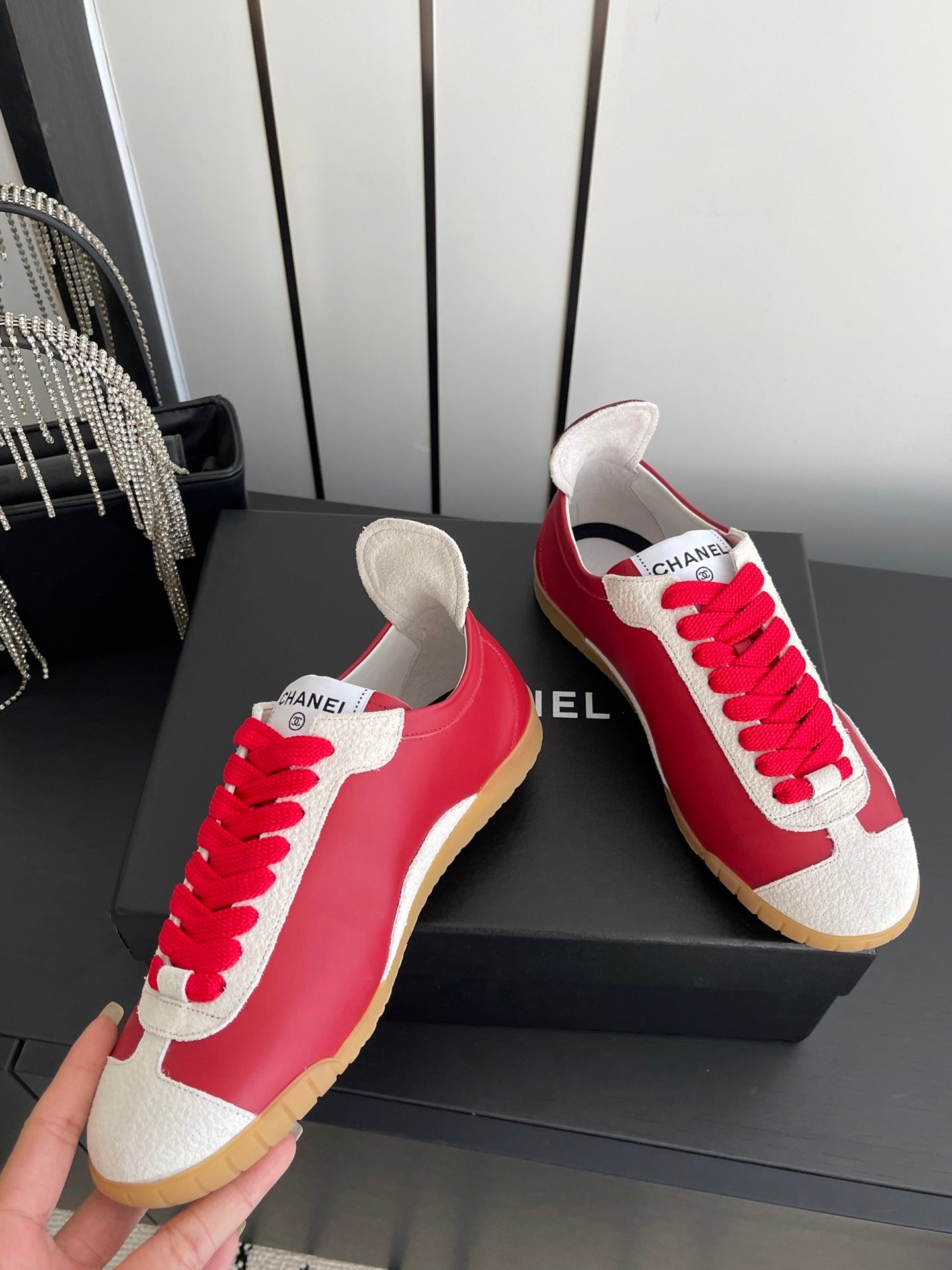 CHANEL LOW-TOP SNEAKERS IN RED CALFSKIN MIX SUEDE
