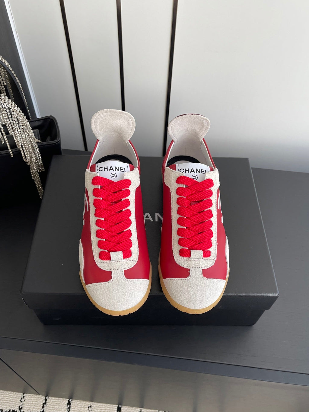 CHANEL LOW-TOP SNEAKERS IN RED CALFSKIN MIX SUEDE