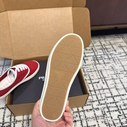 PRADA 26S LACE UP SNEAKERS IN RED CANVAS