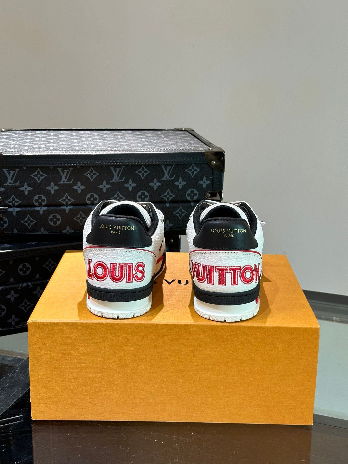 LV TRAINER SNEAKERS IN WHITE CALFSKIN AND BLACK MIX RED SUEDE
