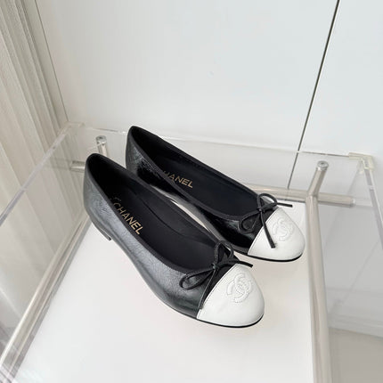 CHANEL 26S BALLET FLATS IN BLACK CRACKED CALFSKIN WITH WHITE TOE CAP AND BOW