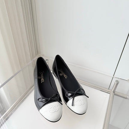 CHANEL 26S BALLET FLATS IN BLACK CRACKED CALFSKIN WITH WHITE TOE CAP AND BOW
