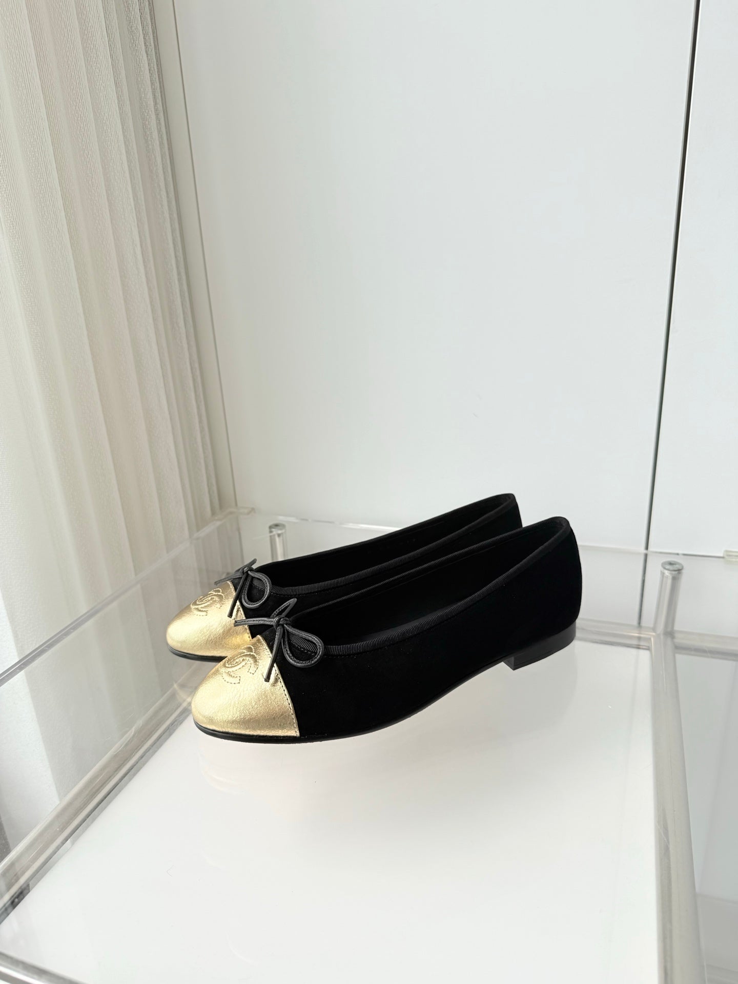 CHANEL 26S BALLET FLATS IN BLACK SUEDE WITH GOLD TOE CAP AND BOW