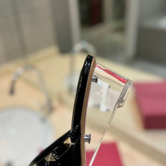 ROCKSTUD MULE SANDALS WITH TRANSPARENT HEEL IN BLACK CALFSKIN