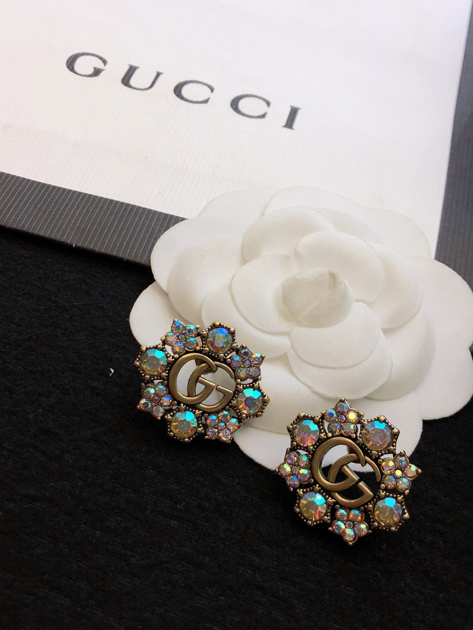 GUCCI 26S DOUBLE G LOGO MULTICOLOR CRYSTAL FLORAL STATEMENT STUD EARRINGS IN AGED GOLD TONE METAL 629028