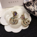 GUCCI 26S DOUBLE G LOGO MULTICOLOR CRYSTAL DROP STATEMENT EARRINGS IN AGED GOLD TONE METAL 629027
